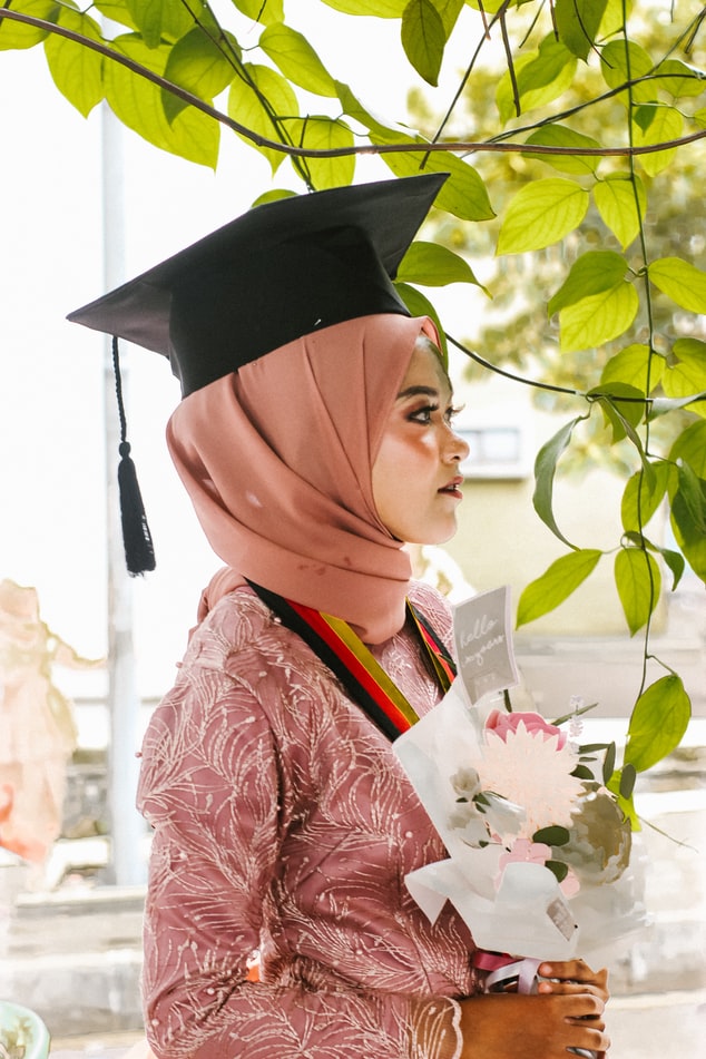 girl in pink graduating